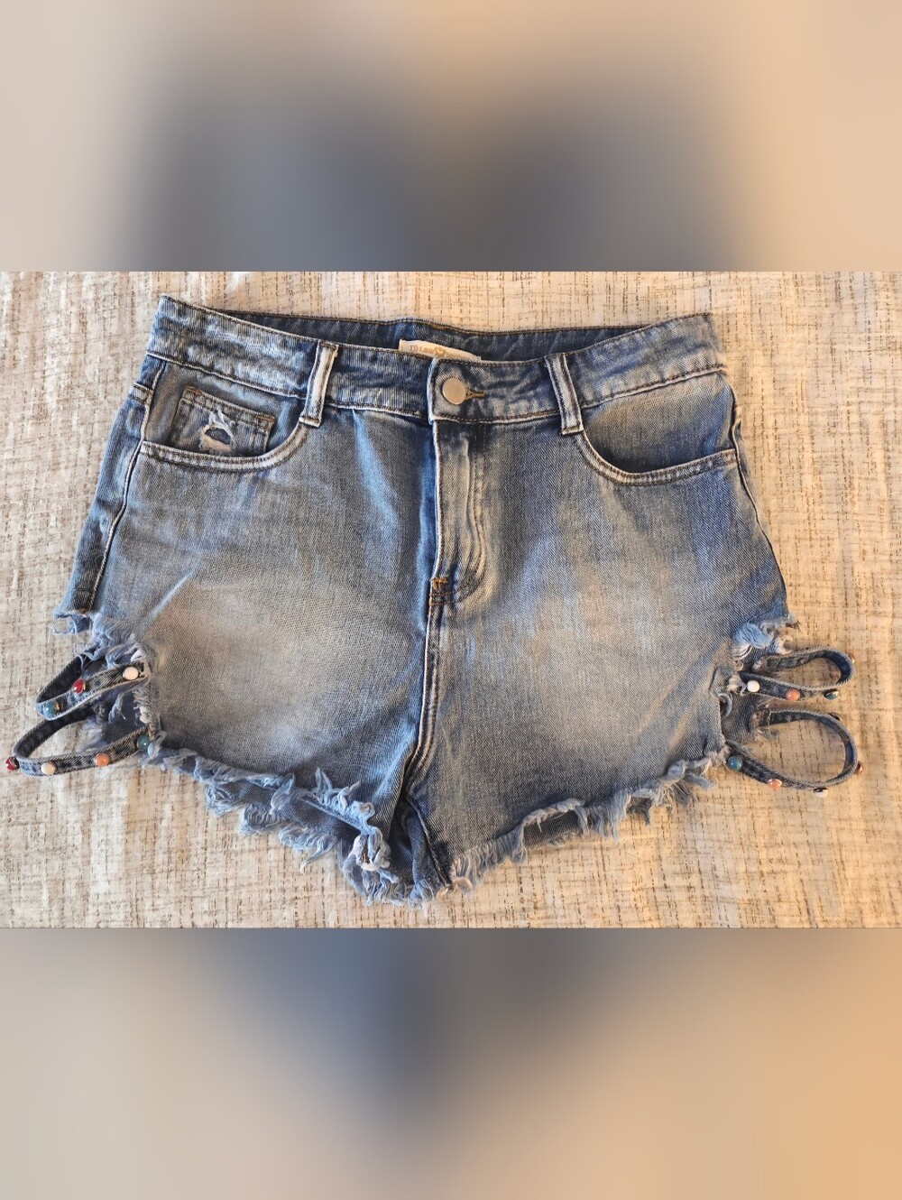 Women's Distressed Denim Cutoff Shorts With Side Bead Details